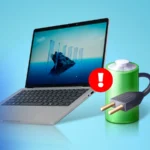 a laptop next to a green battery icon with a power plug and a red warning sign
