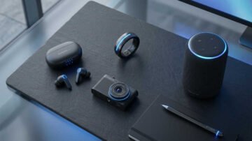 Gadgets con IA integrada: auriculares, anillo inteligente, cámara y altavoz sobre superficie oscura